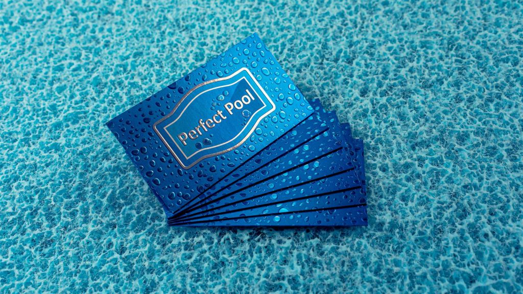 blue embossed business cards with raised print water drops on small surface area