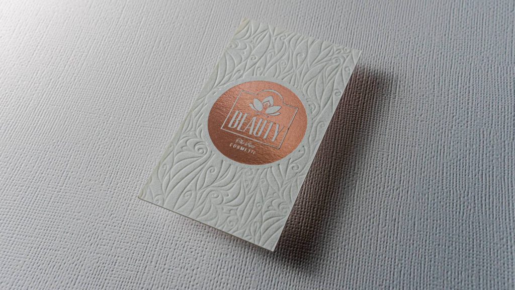 white cotton foil debossed business card with foil logo