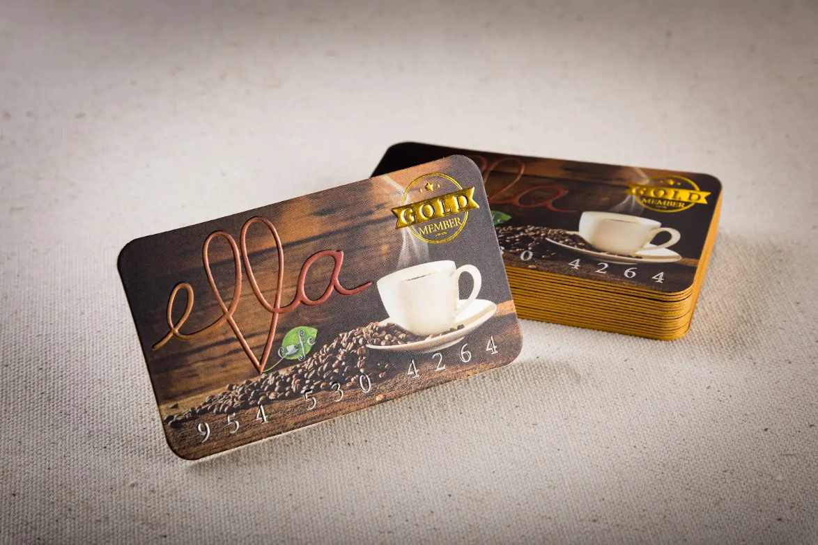 Side-by-side comparison of hot-stamped gold foil card and digital sleeked gold foil card