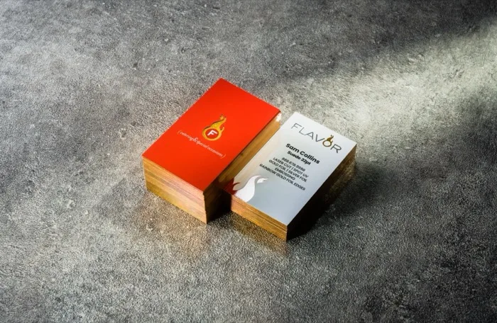 Flavor catering business card printed on Suede 32pt stock with rainbow gold foil edges